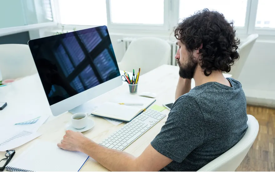 Contract QA professional working at a dedicated desk setup